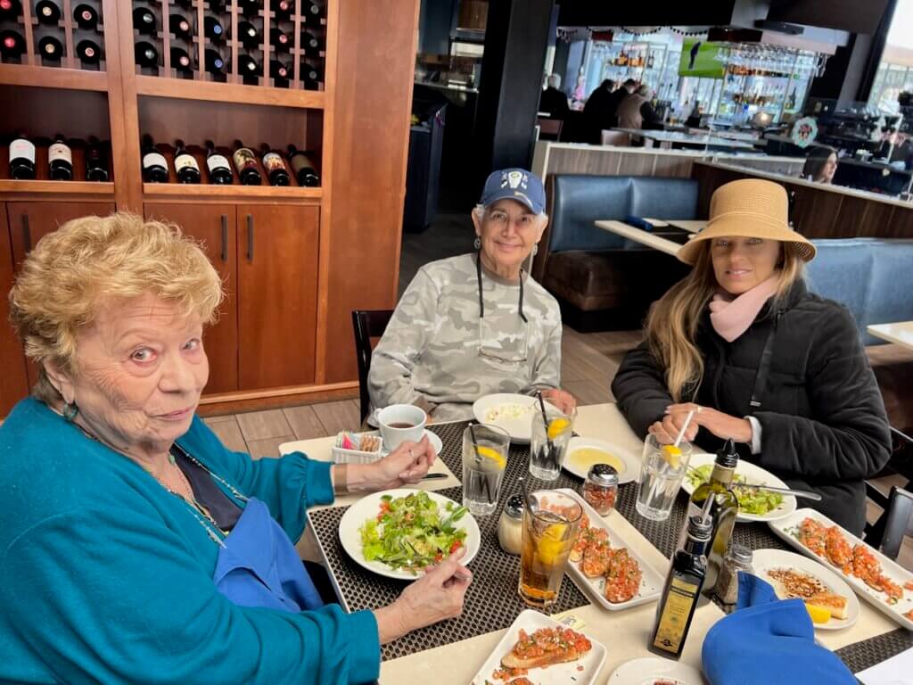 
            Elena Boulter (foreground, left) with two other Malibu Garden Club members at Spruzzos.
        