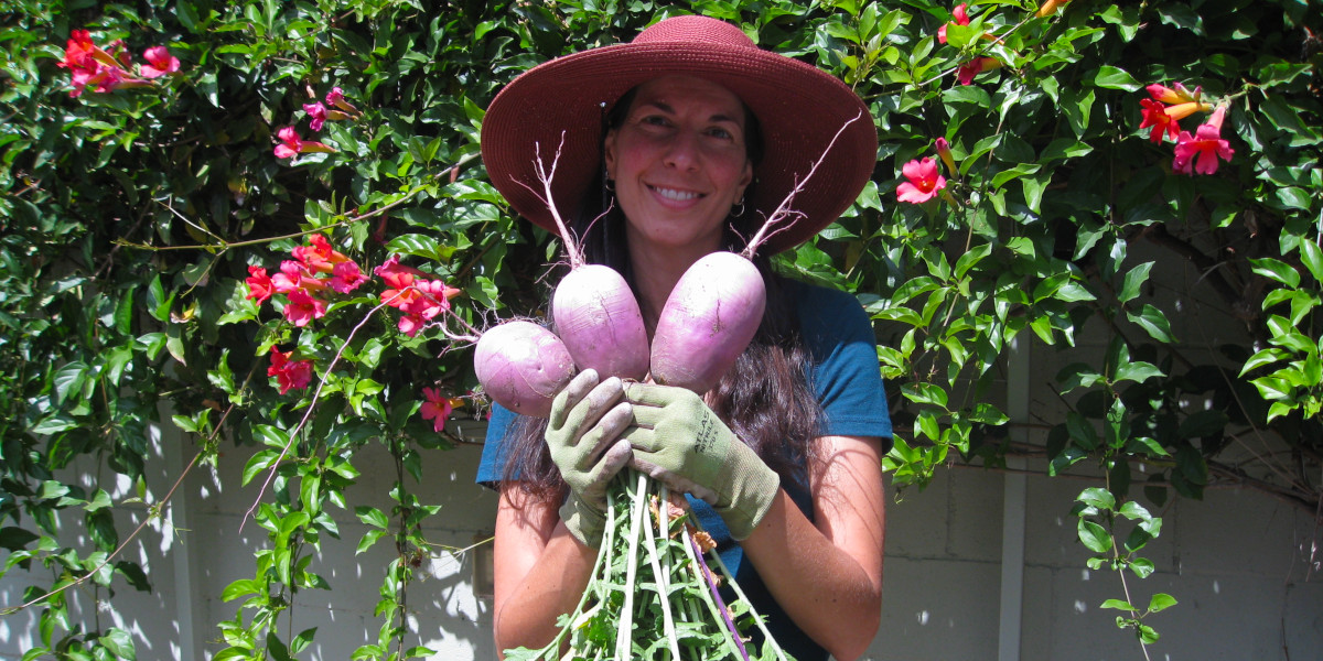Christy Wilhelmi holding large radishes