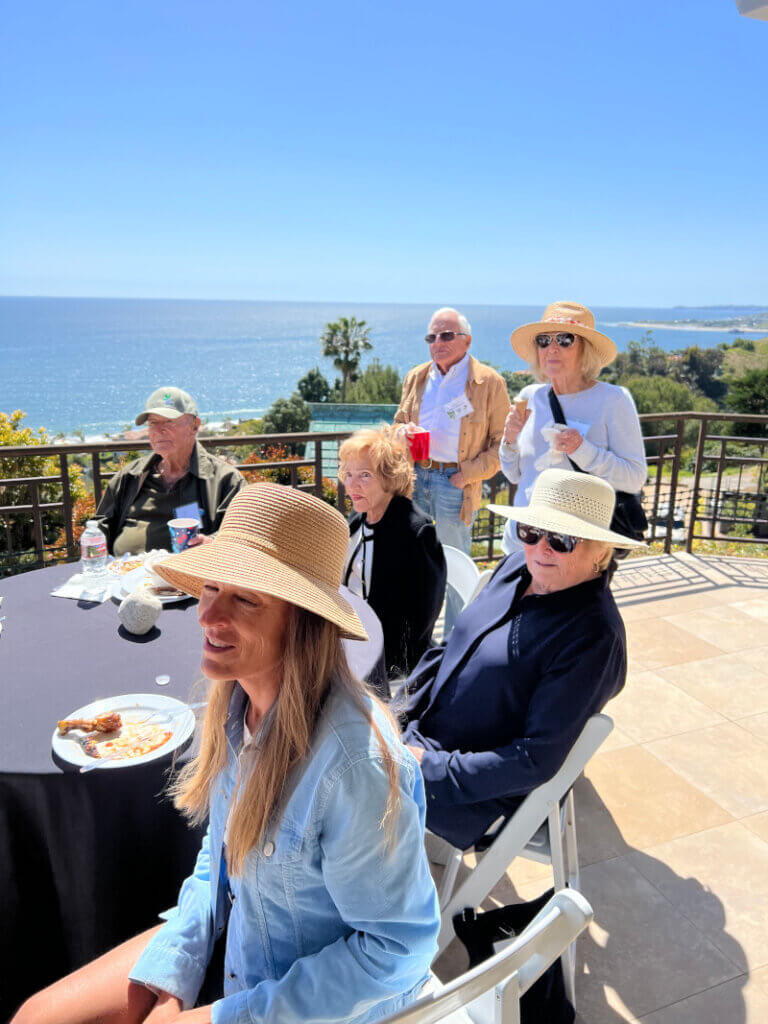 Members of the Malibu Garden Club dining along the ocean