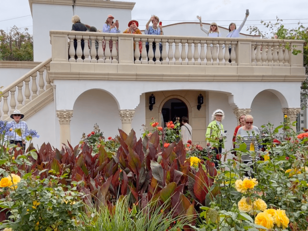 Members waving hello at Cathey Cadieux’s Rose Garden and Home